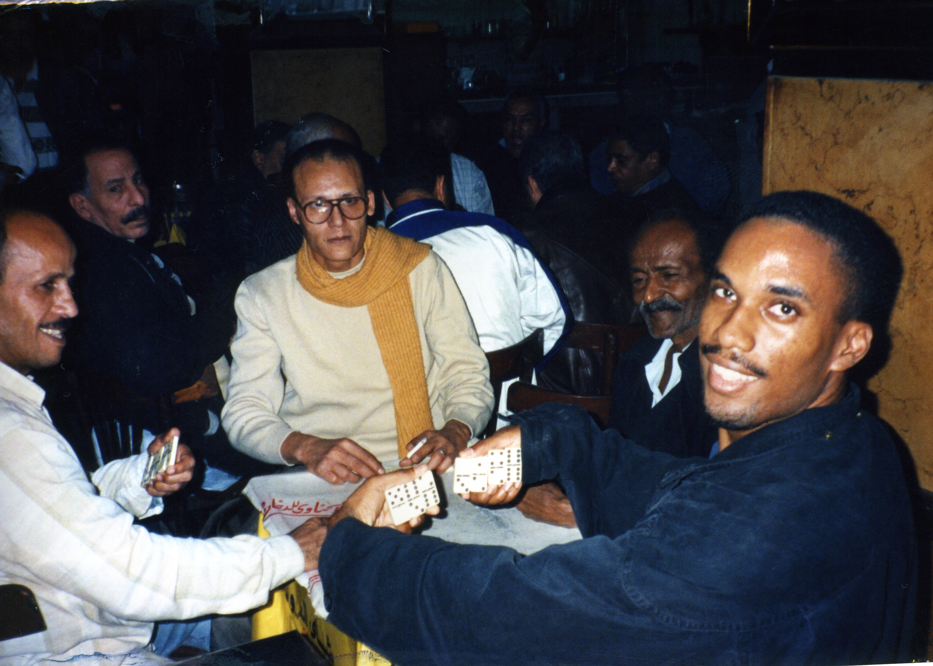 This is me playing dominoes in Cairo, Egypt in the 1990s. I couldn't speak arabic, but my partner and I killed it. Never play against a guy wearing a scarf with that much confidence.